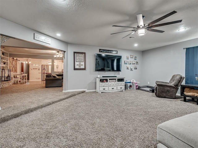 434 N Oak Ave, Hennessey, OK 73742 - living area featuring ceiling fan, a textured ceiling, carpet floors, recessed lighting, and a chandelier