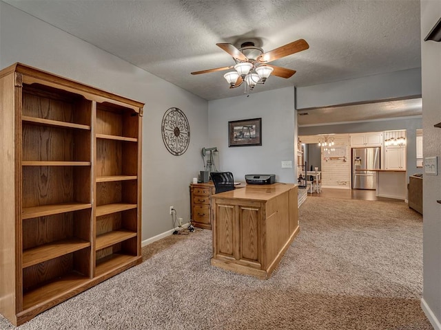 434 N Oak Ave, Hennessey, OK 73742 - home office featuring ceiling fan, light carpet, and a textured ceiling