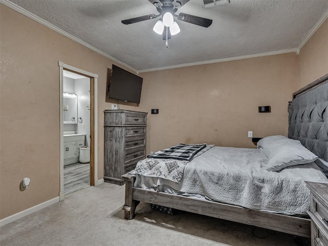 434 N Oak Ave, Hennessey, OK 73742 - bedroom with light colored carpet, ornamental molding, a textured ceiling, ceiling fan, and connected bathroom