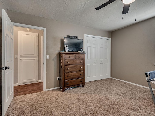 434 N Oak Ave, Hennessey, OK 73742 - carpeted bedroom featuring a closet, a textured ceiling, and ceiling fan