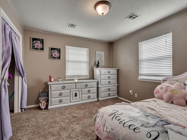 434 N Oak Ave, Hennessey, OK 73742 - carpeted bedroom featuring a textured ceiling
