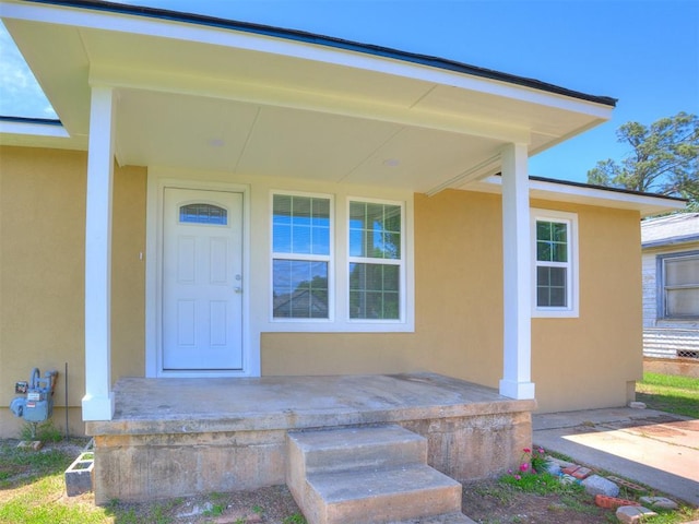 3609 S Quapah Ave, Oklahoma City, OK 73119 - doorway to property with stucco siding and covered porch