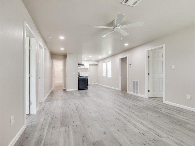 3609 S Quapah Ave, Oklahoma City, OK 73119 - unfurnished living room featuring light wood finished floors, a ceiling fan, and recessed lighting