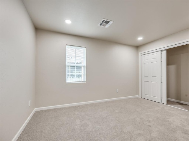 3609 S Quapah Ave, Oklahoma City, OK 73119 - unfurnished bedroom featuring light carpet, recessed lighting, and a closet