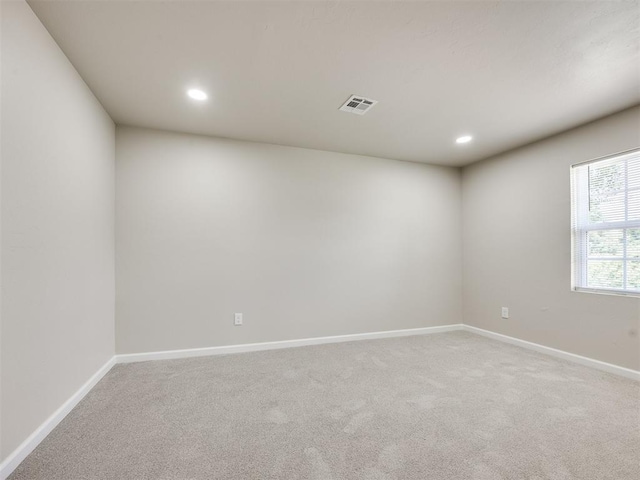 3609 S Quapah Ave, Oklahoma City, OK 73119 - spare room featuring light carpet and recessed lighting
