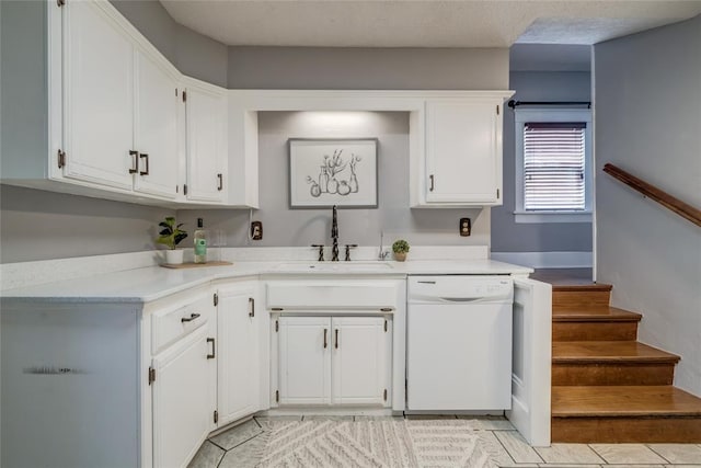 904 NW 19th St, Oklahoma City, OK 73106 - kitchen featuring dishwasher, white cabinetry, light countertops, and light tile patterned floors
