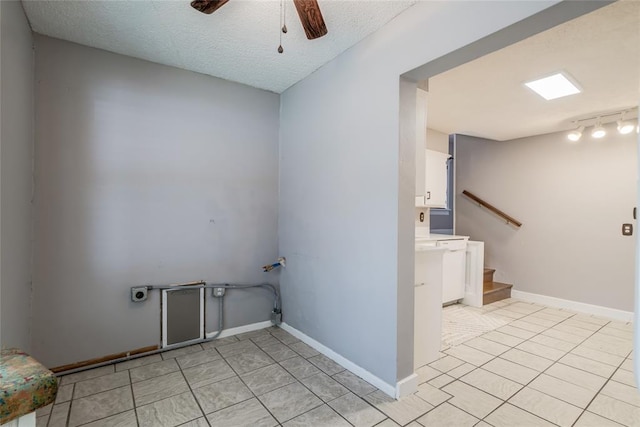 904 NW 19th St, Oklahoma City, OK 73106 - washroom with ceiling fan, light tile patterned floors, and a textured ceiling