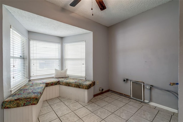 904 NW 19th St, Oklahoma City, OK 73106 - unfurnished room with a textured ceiling, ceiling fan, and light tile patterned floors
