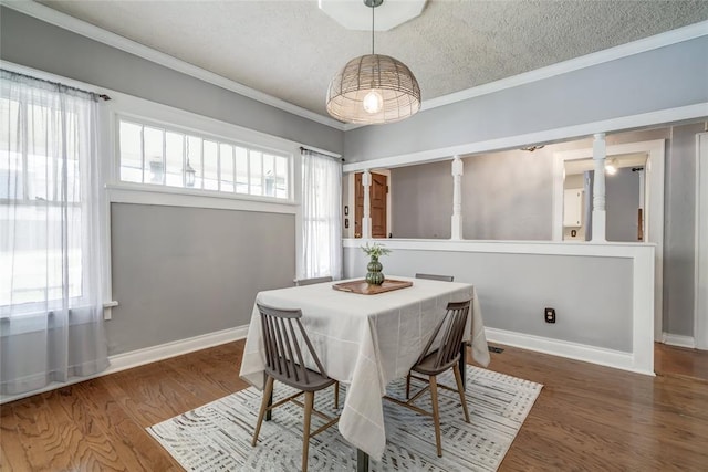 904 NW 19th St, Oklahoma City, OK 73106 - dining space featuring crown molding, a textured ceiling, and wood finished floors
