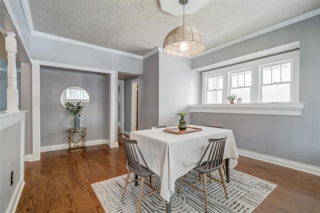 904 NW 19th St, Oklahoma City, OK 73106 - dining room featuring a textured ceiling, wood finished floors, and ornamental molding