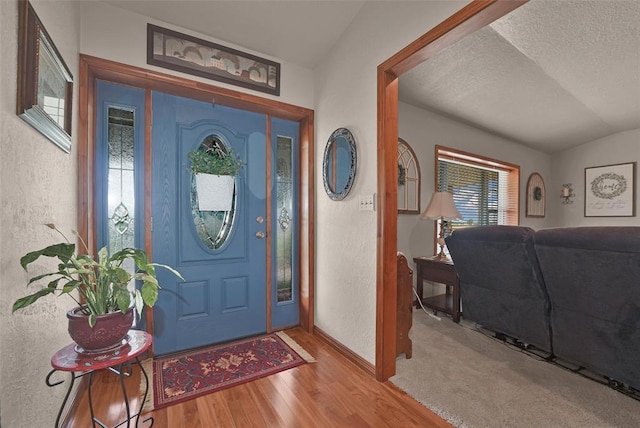 22071 E 1250th Rd, Rocky, OK 73661 - foyer featuring wood finished floors, a textured ceiling, and a textured wall