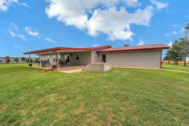 22071 E 1250th Rd, Rocky, OK 73661 - rear view of property with a patio area and a lawn
