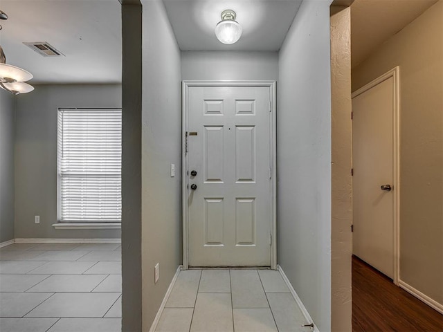 12300 NW 4th St, Yukon, OK 73099 - entryway with light tile patterned floors and baseboards
