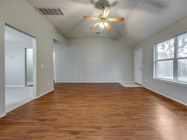 12300 NW 4th St, Yukon, OK 73099 - empty room featuring a ceiling fan, wood finished floors, and vaulted ceiling