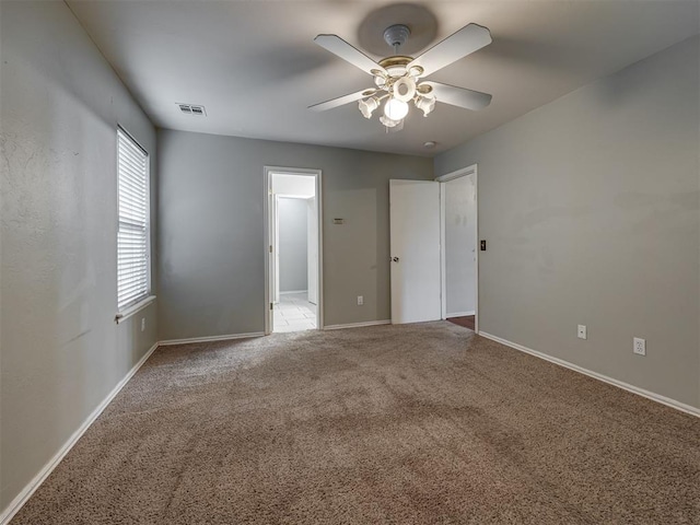 12300 NW 4th St, Yukon, OK 73099 - unfurnished bedroom featuring carpet floors and ceiling fan