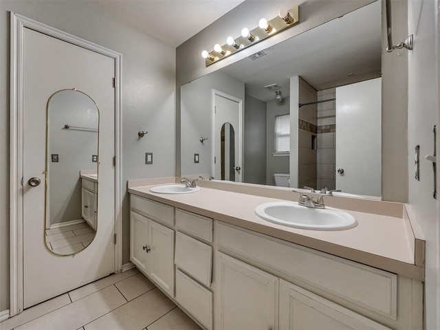 12300 NW 4th St, Yukon, OK 73099 - bathroom with tile patterned flooring and double vanity