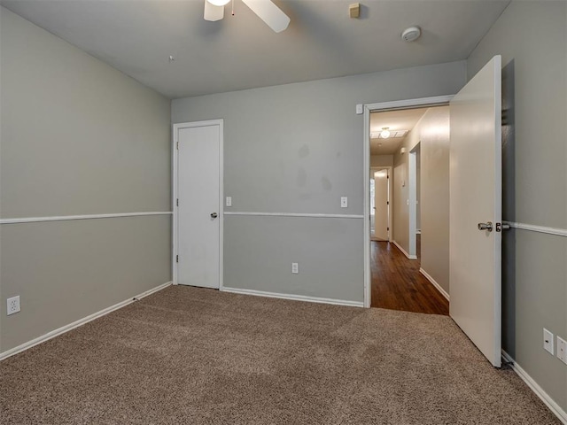 12300 NW 4th St, Yukon, OK 73099 - carpeted empty room with a ceiling fan and a smoke detector