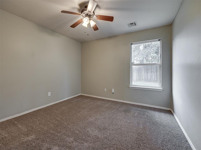 12300 NW 4th St, Yukon, OK 73099 - carpeted spare room with a ceiling fan and baseboards