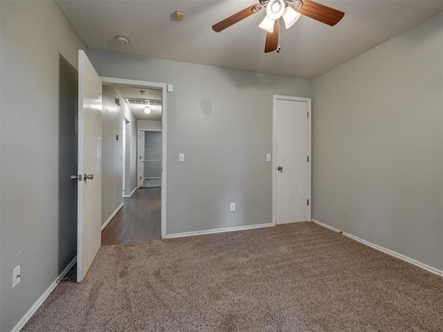 12300 NW 4th St, Yukon, OK 73099 - unfurnished bedroom featuring carpet flooring and a ceiling fan