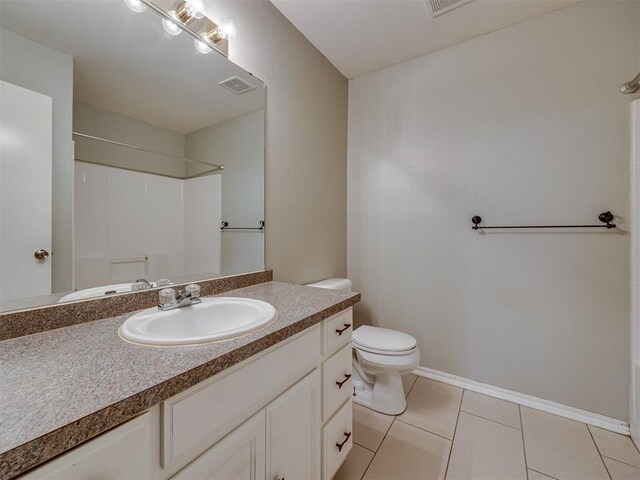12300 NW 4th St, Yukon, OK 73099 - full bathroom featuring vanity, a shower, and tile patterned flooring