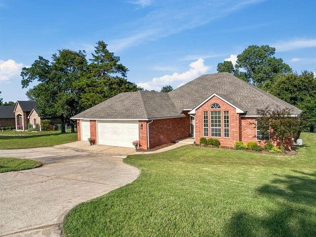 12200 Whispering Pnes, Guthrie, OK 73044 - view of front of property featuring a front lawn, driveway, an attached garage, and brick siding