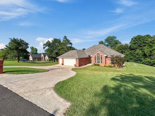 12200 Whispering Pnes, Guthrie, OK 73044 - view of front of house featuring a garage, driveway, brick siding, and a front yard