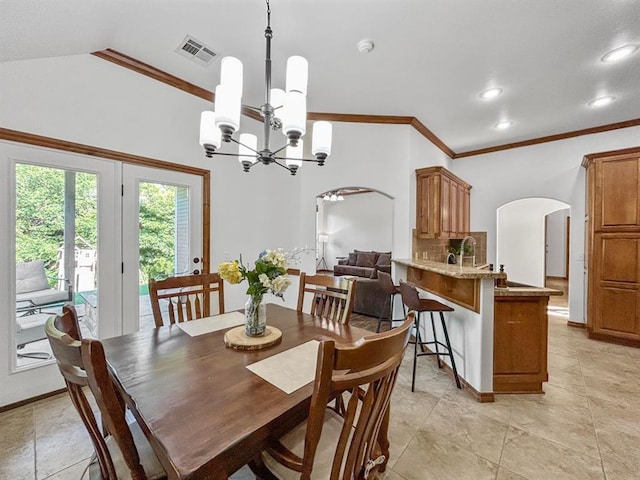 12200 Whispering Pnes, Guthrie, OK 73044 - dining room featuring arched walkways, a chandelier, lofted ceiling, crown molding, and recessed lighting