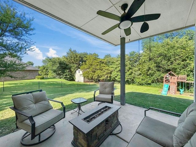 12200 Whispering Pnes, Guthrie, OK 73044 - view of patio featuring an outdoor fire pit, a playground, and a ceiling fan