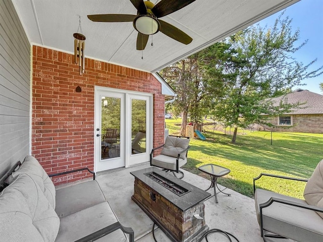 12200 Whispering Pnes, Guthrie, OK 73044 - view of patio with a fire pit, a playground, and ceiling fan