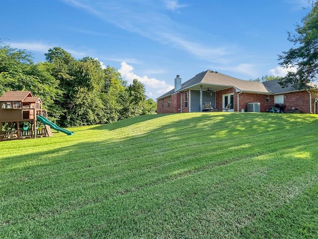 12200 Whispering Pnes, Guthrie, OK 73044 - view of green lawn with a playground and ceiling fan