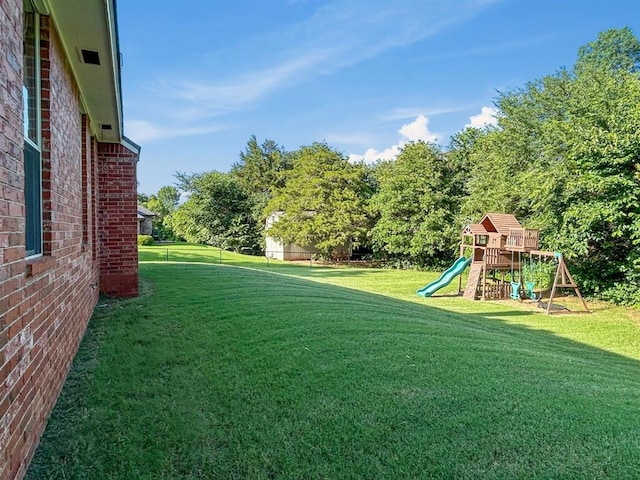 12200 Whispering Pnes, Guthrie, OK 73044 - view of grassy yard with a playground