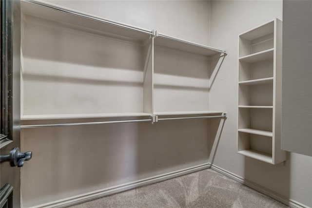 3904 Normandy Rd, Edmond, OK 73013 - walk in closet featuring carpet