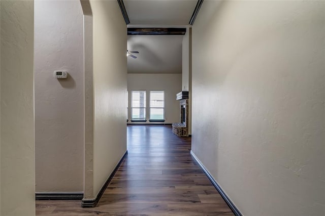 3904 Normandy Rd, Edmond, OK 73013 - corridor featuring wood finished floors, arched walkways, and a textured wall