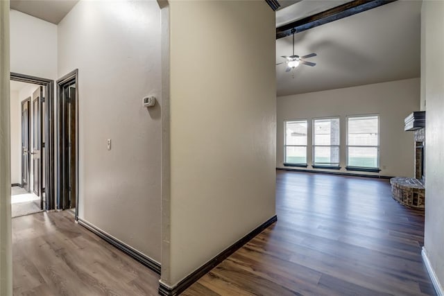 3904 Normandy Rd, Edmond, OK 73013 - hallway featuring wood finished floors, beam ceiling, and high vaulted ceiling
