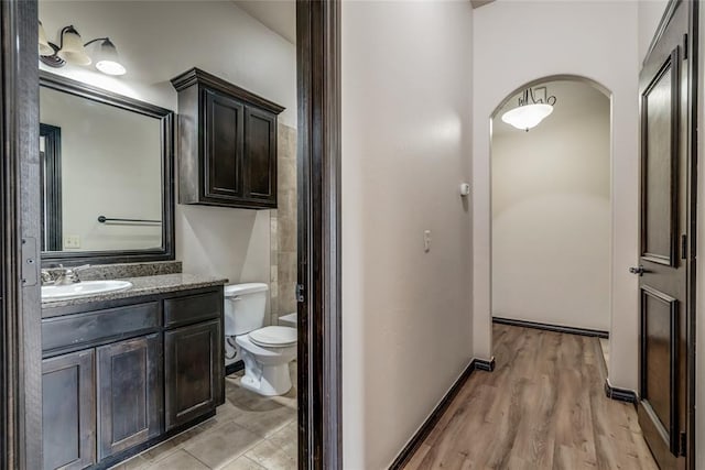 3904 Normandy Rd, Edmond, OK 73013 - bathroom featuring vanity and wood finished floors