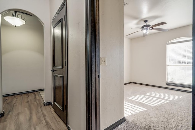 3904 Normandy Rd, Edmond, OK 73013 - hall featuring arched walkways and a textured wall