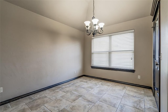3904 Normandy Rd, Edmond, OK 73013 - spare room with vaulted ceiling and a chandelier