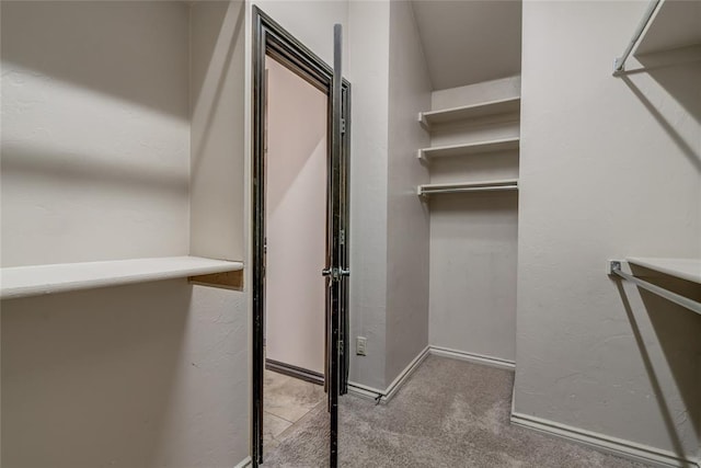 3904 Normandy Rd, Edmond, OK 73013 - spacious closet featuring carpet