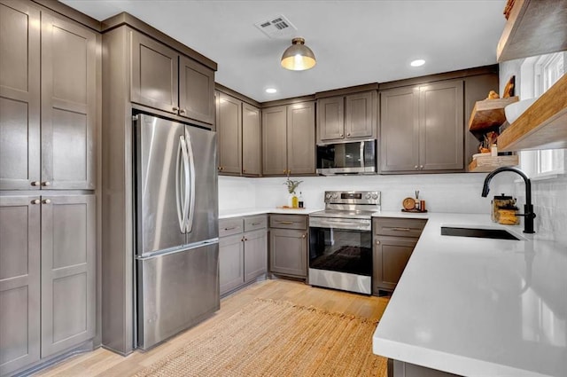 14500 Williams Way, Luther, OK 73054 - kitchen featuring appliances with stainless steel finishes, open shelves, recessed lighting, and light countertops