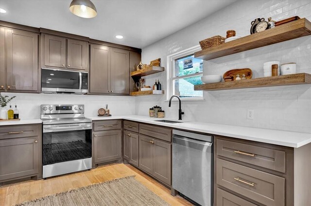 14500 Williams Way, Luther, OK 73054 - kitchen with open shelves, stainless steel appliances, light wood-type flooring, light countertops, and recessed lighting
