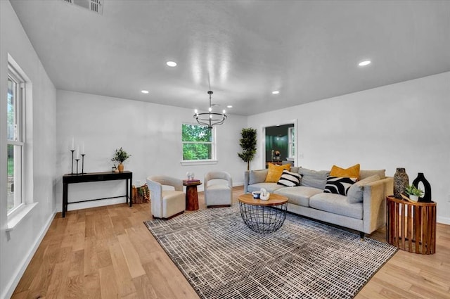 14500 Williams Way, Luther, OK 73054 - living room with light wood finished floors, a chandelier, and recessed lighting