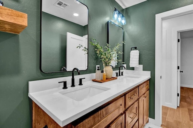 14500 Williams Way, Luther, OK 73054 - bathroom featuring double vanity and wood finished floors