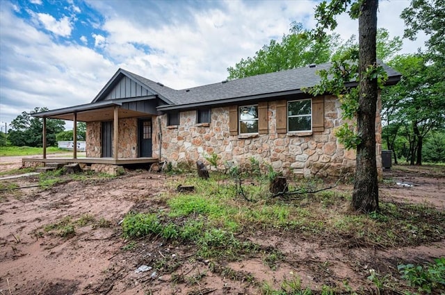 14500 Williams Way, Luther, OK 73054 - view of front of home with stone siding, board and batten siding, and a shingled roof