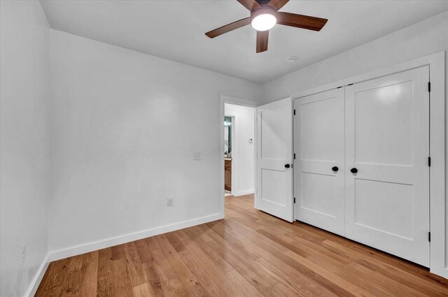 14500 Williams Way, Luther, OK 73054 - unfurnished bedroom with light wood finished floors, a closet, and a ceiling fan