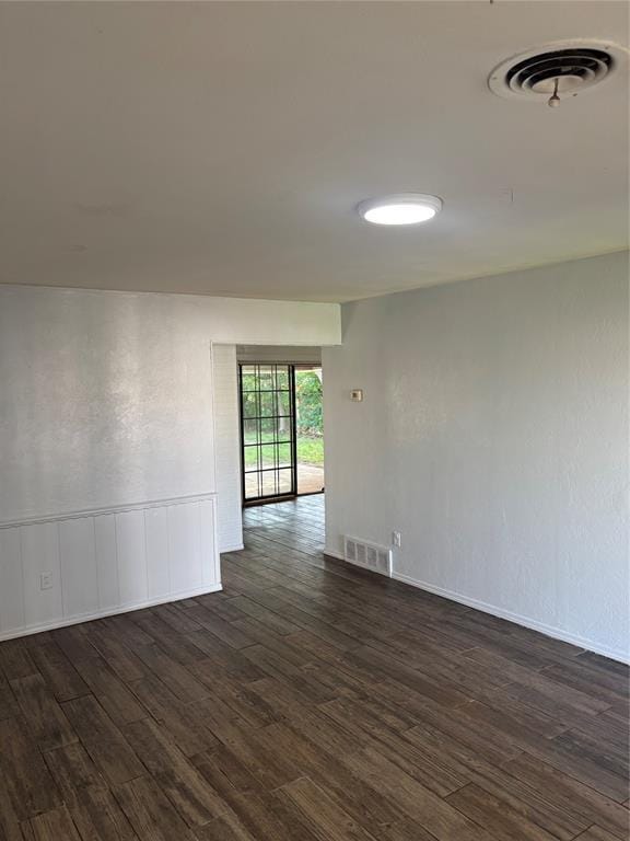 833 S Scott St, Del City, OK 73115 - unfurnished room with dark wood finished floors