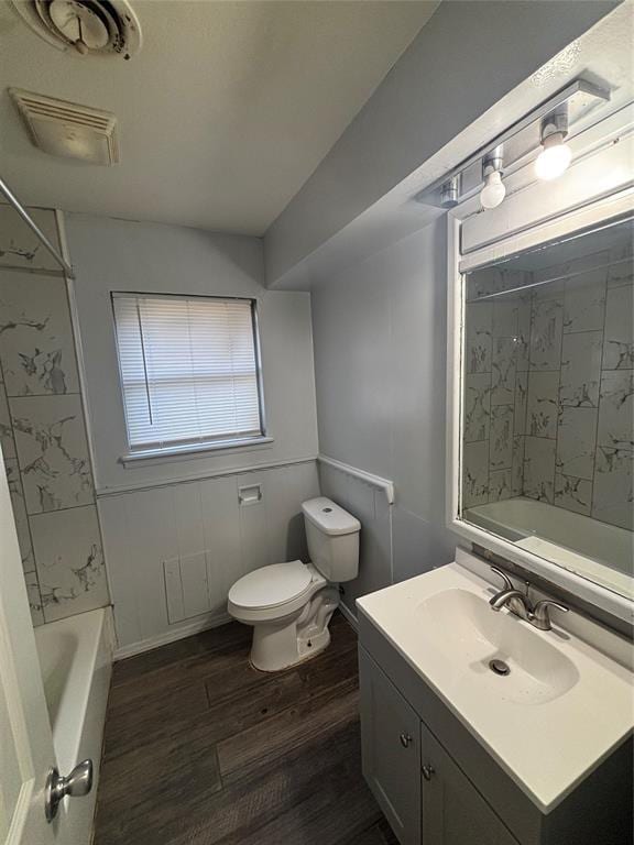 833 S Scott St, Del City, OK 73115 - bathroom featuring vanity, wood finished floors, and  shower combination