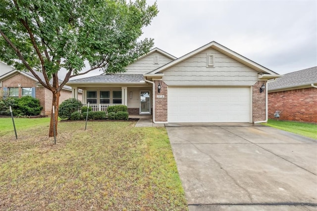 2718 Sharpish Way, Norman, OK 73069 - view of front of home featuring brick siding, a garage, a front lawn, and concrete driveway