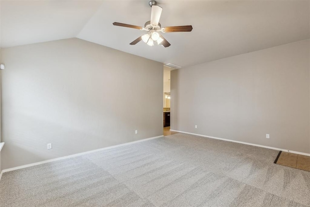 2718 Sharpish Way, Norman, OK 73069 - empty room featuring carpet floors, a ceiling fan, and vaulted ceiling