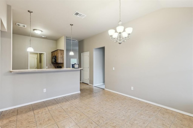 2718 Sharpish Way, Norman, OK 73069 - kitchen featuring black microwave, a chandelier, light tile patterned floors, decorative light fixtures, and lofted ceiling
