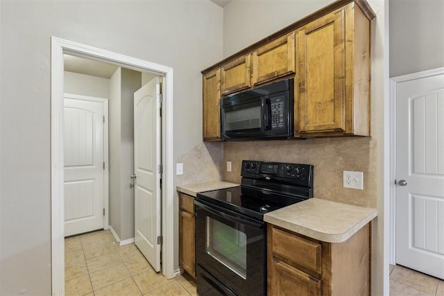 2718 Sharpish Way, Norman, OK 73069 - kitchen with black appliances, light countertops, brown cabinetry, decorative backsplash, and light tile patterned flooring